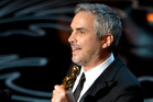 Alfonso Cuaron accepts the award for best director for Gravity during the Oscars. Photo/AP Alfonso Cuaron accepts the award for best director for Gravity during the Oscars. Photo/AP