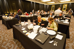 Judges scrutinising the country's best cheese.