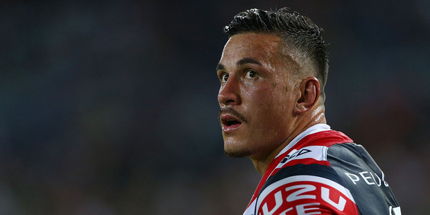 Sonny Bill Williams looks up at a replay of his shoulder charge during the round one NRL match between the South Sydney Rabbitohs and the Sydney Roosters. Photo / Getty Images.