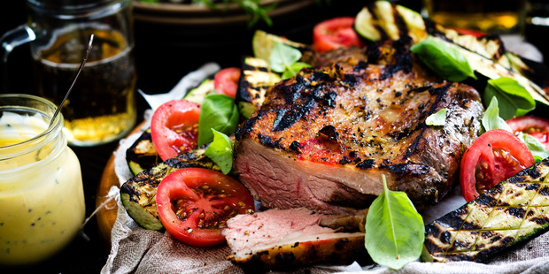 Barbecue lamb with tomatoes and courgettes. Photo / Babiche Martens.