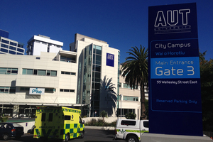 An ambulance outside AUT where two people were treated after an explosion. Photo / Richard Robinson