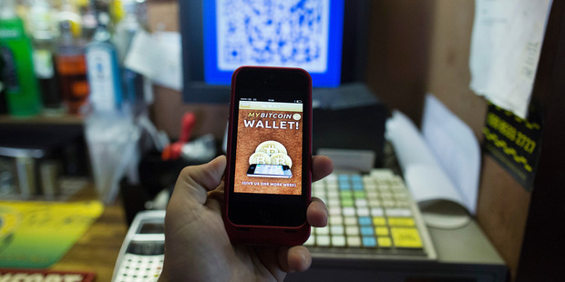 The Bitcoin smartphone app shown on a smartphone. Newsweek magazine says it has found the mysterious creator of the online currency. Photo / AP