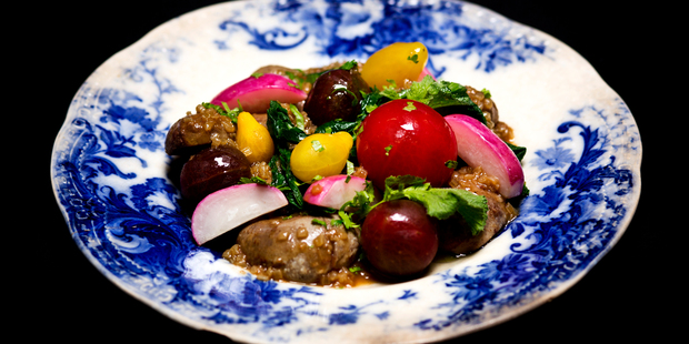 Devilled lamb's kidneys with cherry tomatoes and radishes, by Joao Martins from The Offal Club. Photo / Babiche Martens