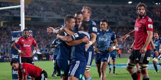 Blues celebrate Jackson Willison's try against the Crusaders. Photo / Richard Robinson