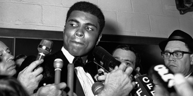 Reporters surround Muhammad Ali in Toronto. Photo / AP