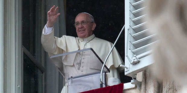 Pope Francis blesses faithful during his weekly mass on Sunday. Photo / AP