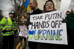 Pro-Ukraine supporters based in London send their message to Russian president Vladimir Putin. The crisis could have implications for NZ's Security Council ambitions. Photo / AP