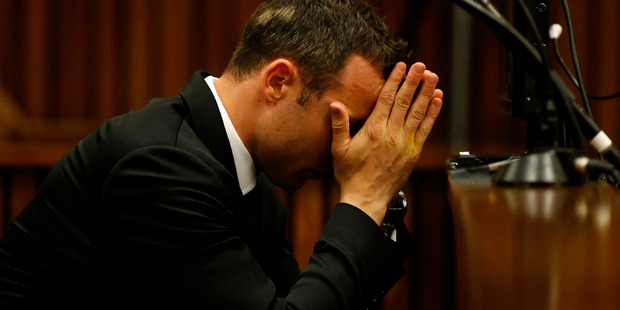 Oscar Pistorius sits in the dock in court on the third day of his trial at the high court in Pretoria. Photo / AP