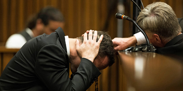 Oscar Pistorius, puts his hands to his head while listening to evidence from a witness speaking about the morning of the shooting of his girlfriend Reeva Steenkamp. Photo / AP