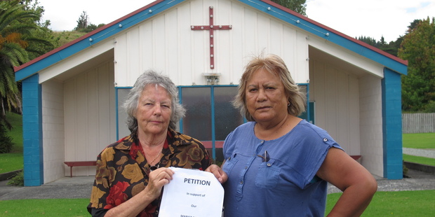 Parishioners Maata Job Rakena, left, and Jeanette Kinneally with a 400-signature petition calling on the Marist order to keep its nuns in Waitaruke. Photo/Peter de Graaf