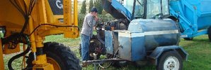 VANISHED: The blue fuel trailer with tank (centre), holding 200 litres of diesel, was stolen from Matahiwi Winery.PHOTO/SUPPLIED.