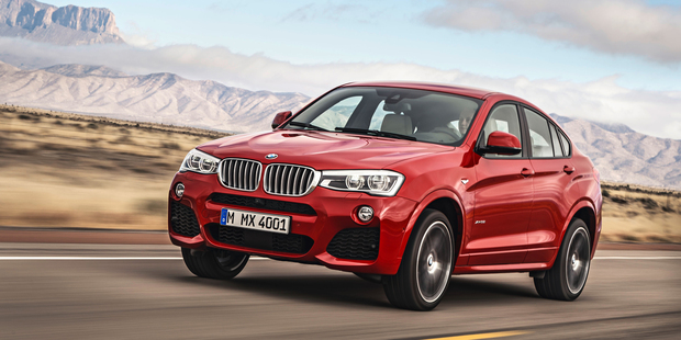 BMW X4 is a sportier derivative of the X3 with a silhouette that's reminiscent of a coupe and a slightly more aggressive-looking body.
