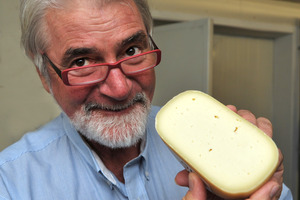 Master Judge Russell Smith with Aged Gouda Barrys Bay Traditional Cheese.
