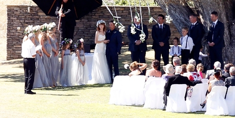 Despite a big black umbrella, the wedding of Adam Parore and Miller Rose Macleod-McGhie in Omapere was still papped. Photo / Michael Craig