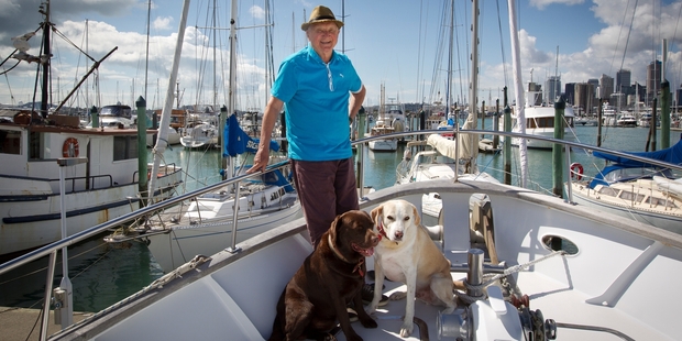 Peter Williams on his boat with his dogs, Kafka and Ariki, at Westhaven Marina. Photo / Sarah Ivey