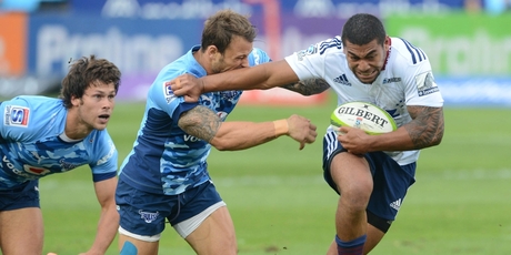 Blues fullback Charles Piutau can't escape the clutches of Francois Hougaard in the game against the Bulls at Loftus Versfeld yesterday. Photo / Getty Images