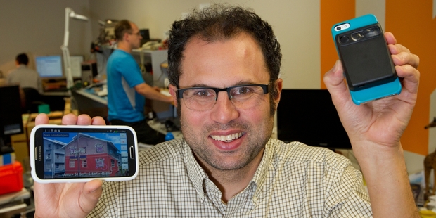 Leon Toorenburg with the Spike smartphone attachment for laser-accurate measurement. Photo / Mark Mitchell
