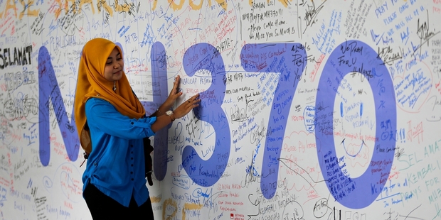 The loss of the Malaysian airliner has made headlines around the world and left thousands of friends and relatives anxiously waiting for news. Photo / AP