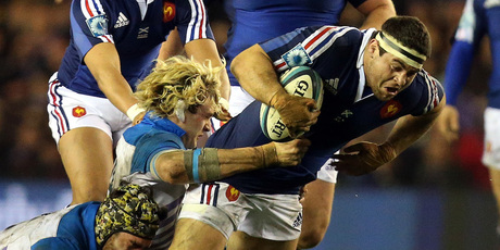 France's Guilhem Guirado, right, is tackled by Scotland's Richie Gray and Kelly Brown. Photo / AP
