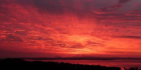 Today's sunrise taken from Parau looking toward south Auckland and the Hunua Ranges. Photo / Andrew Blackler