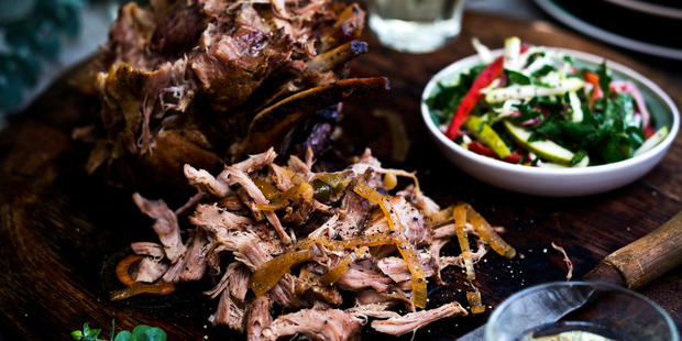 Slow-roasted pork leg with pomegranate slaw. Photo / Babiche Martens.