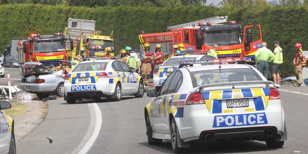 A Tauranga woman in her 20s died at the scene of a two-car crash north of Te Puke yesterday.