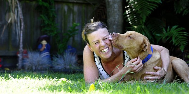 Terri Mann with her and her partner's adopted 9-month-old pitbull terrier cross renamed Delvinious or Del for short. Photo/George Novak