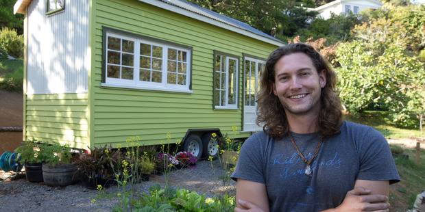 Bryce Langston with a somewhat smaller house than the mighty one he grew up in. Photo / Brett Phibbs
