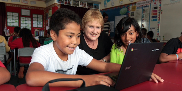 May Rd School principal Lynda Stuart flanked by pupils Bronson Tipama'a (left) and Jumaanah Vahora. Photo / Doug Sherring