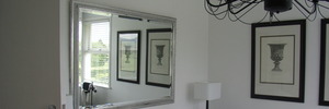 The romance of a white bedroom is given a subtle edge with black and silver.