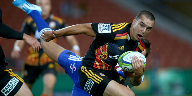 ames Lowe of the Chiefs is tackled by Jacobus Petrus Van Wyk of the Stormers during the round five Super Rugby match between the Chiefs and the Stormers. Photo / Getty Images.