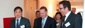 Donghua Liu, left, with John Key at the opening of first stage of the construction project in Newmarket.
