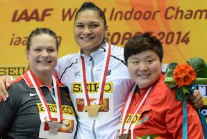 New Zealand's gold medal winner Valerie Adams hugs Germany's silver medal winner Christina Schwanitz, left, and China's bronze medal winner Gong Lijiao. Photo / AP