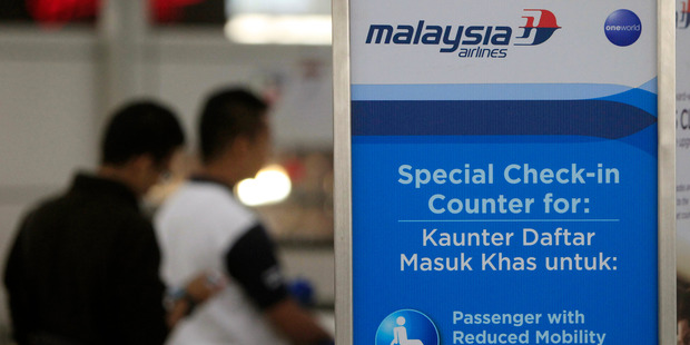 Passengers check in at a Malaysia Airlines counter at Kuala Lumpur International Airport in Sepang. Photo / Getty Images