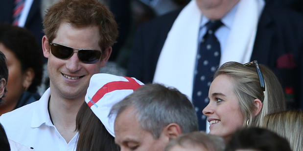 Britain's Prince Harry, left, with his girlfriend Cressida Bonas attend the Six Nations Rugby Union match. Photo / AP