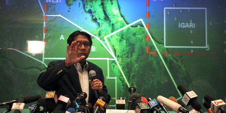 Malaysia's Department of Civil Aviation's Director General Azharuddin Abdul Rahman briefs reporters on search and recovery efforts within existing and new areas. Photo / AP
