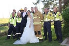 THANK YOU: Volunteer fire crew, mainly from Featherston fire station, surround Wellington newlyweds Tom Knobloch and Micaela Yee at the Brackenridge Country Retreat and Spa near Martinborough. The crew, plus others from Martinborough and Carterton, were called out to battle a tree and scrub fire on the estate's southern boundary.PHOTOS/ANDREW BONALLACK WTA080314ABFIRE02 THANK YOU: Volunteer fire crew, mainly from Featherston fire station, surround Wellington newlyweds Tom Knobloch and Micaela Yee at the Brackenridge Country Retreat and Spa near Martinborough. The crew, plus others from Martinborough and Carterton, were called out to battle a tree and scrub fire on the estate's southern boundary.PHOTOS/ANDREW BONALLACK WTA080314ABFIRE02