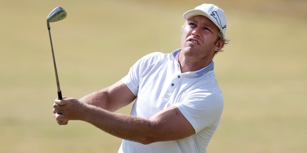 Stormers loose forward Schalk Burger enjoys a round of golf at Formosa Golf Resort at Beachlands yesterday. Photo / Brett Phibbs