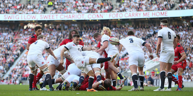 England's Danny Care kicks to touch during his side's Six Nations win over Wales. Photo / AP