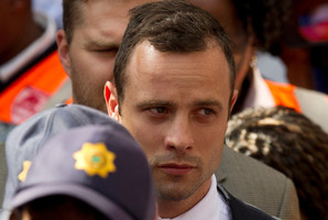 Oscar Pistorius leaves the high court in Pretoria. Photo / AP