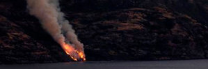 Flames seen up the incline of the isolated Cecil Peak from Steamer Wharf in Queenstown . Photo / Ryan Keen