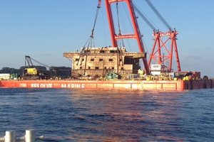 The accommodation block of the container ship Rena has finally risen from beneath the waves, but the position of the stern on the reef has apparently changed.