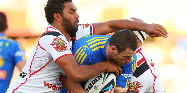 Ben Smith of the Eels is tackled by the Warriors defence. Photo / Getty Images