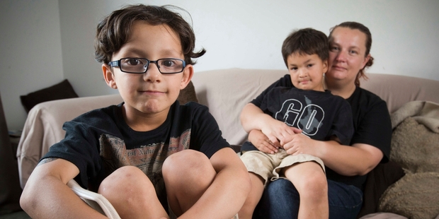 Roman Daniell (left), who needed oral surgery, with his mother, Jenny, and brother, Silas. Photo / Greg Bowker