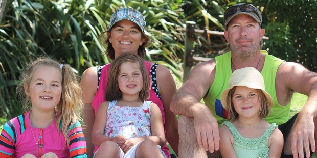 Kelleigh Burkett with daughters Paige, 9, Charli, 5, Holly, 6, and husband Craig.
