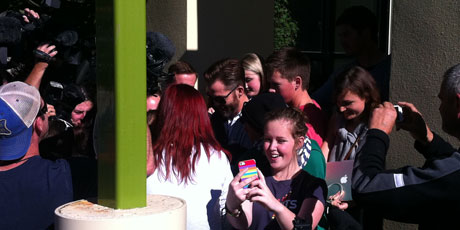 Chris Pine (sporting sunglasses and beard) is surrounded by autograph hunters. Photo / Ashburton Guardian