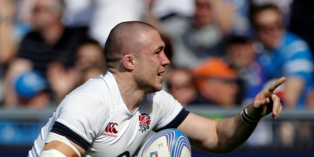 England's Mike Brown celebrates after scoring a try against Italy. Photo / AP