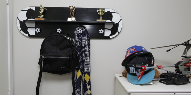 A trophy shelf and cap-and-coat rack in a child's room means never again having to hear, "Mum, where'd you put my cap?" Photo / Michael Craig
