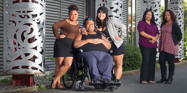 Mr Jason Tamaiti Kihi Phillips with his daughters Marty, left, and Jodie. At rare are Whanau Ora team leader Gail Pohipi and Whanau Ora navigator Selina Koloi. Photo / Alan Gibson