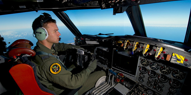 A Royal Australian Air Force pilot steers his AP-3C Orion over the Southern Indian Ocean during the search for missing Malaysian Airlines flight MH370.